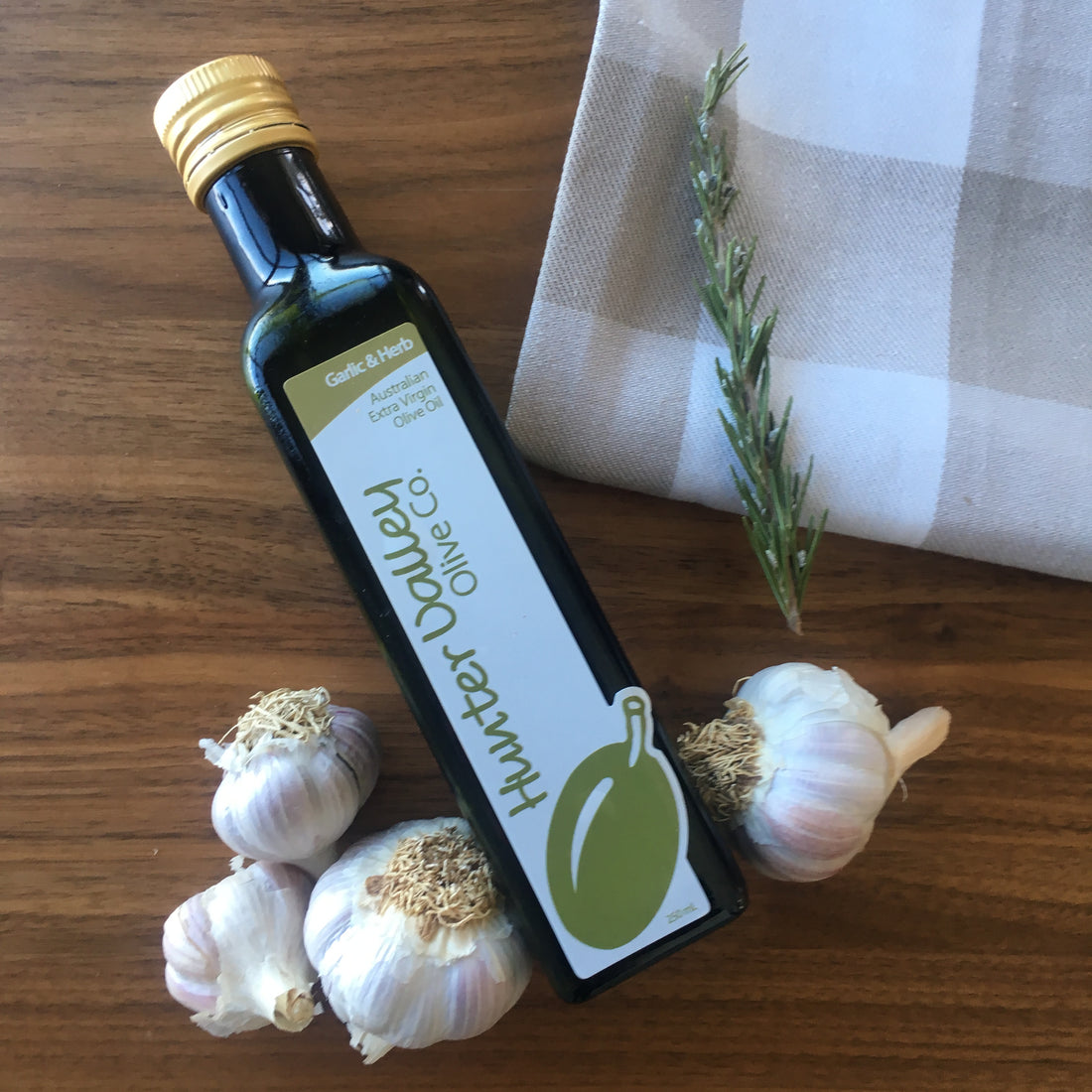 Garlic and herb olive oil, part of our range of flavoured  Extra Virgin Olive Oils